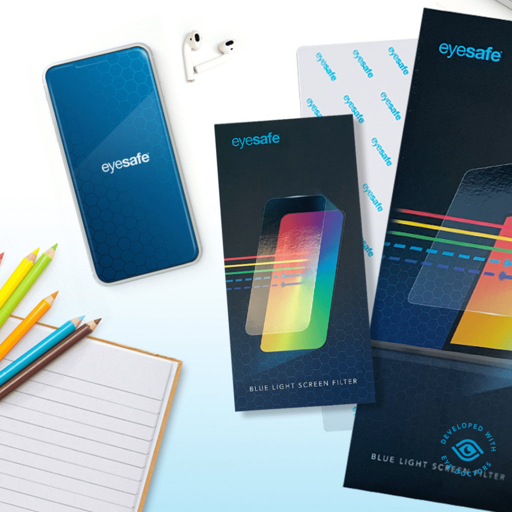 Back-to-School - colored pencils, notebook, headphones, eyesafe blue light screen protector on phone