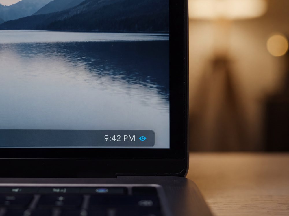 Laptop display corner with the Eyesafe eye glyph showing next to the clock