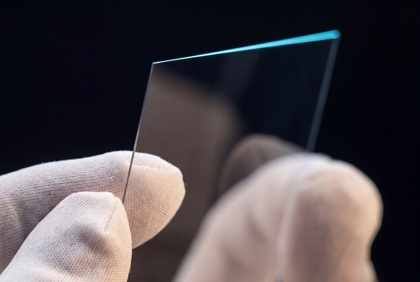 A clear Eyesafe film layer held by a gloved hand
